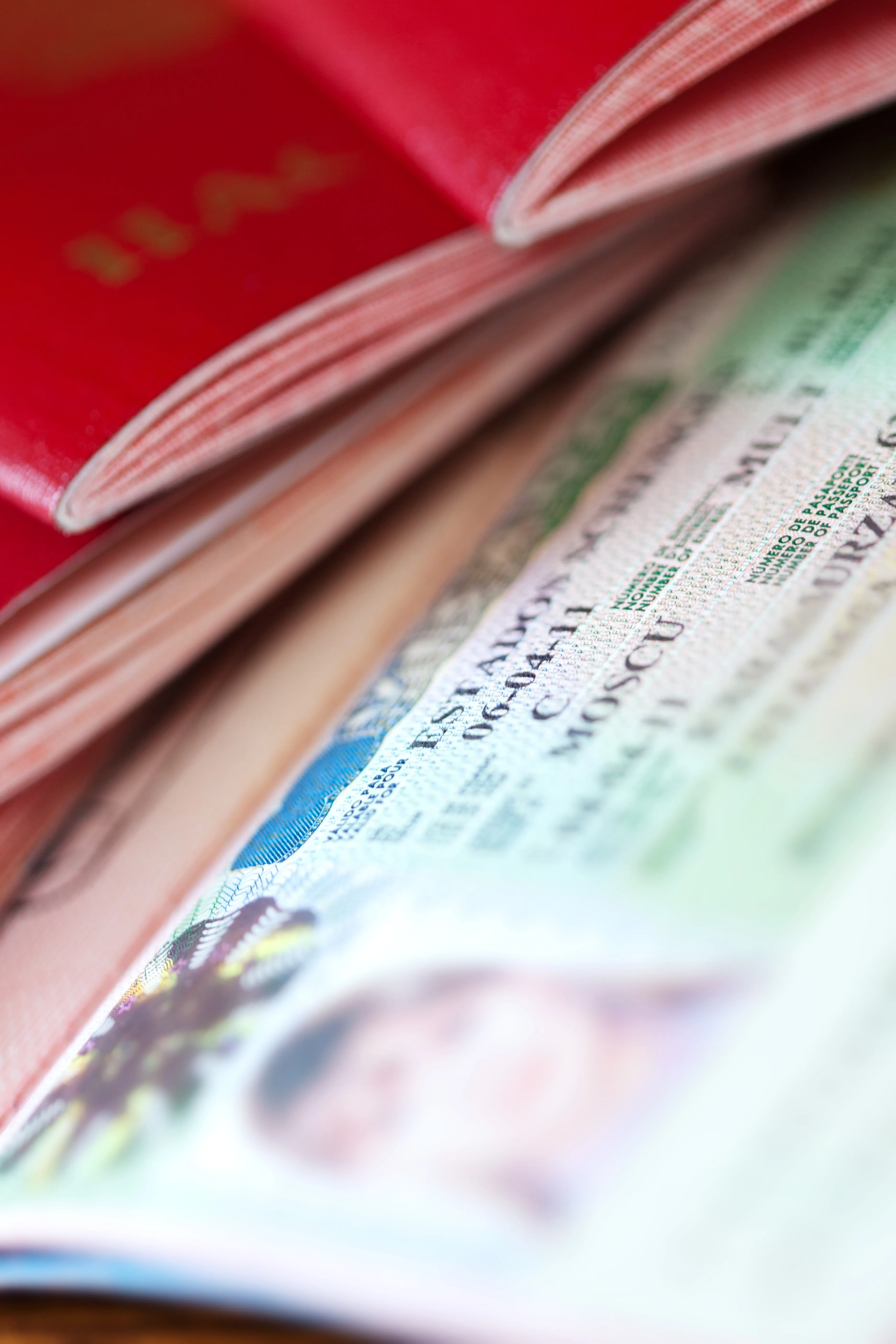 A passport and visa documents, ready for travel