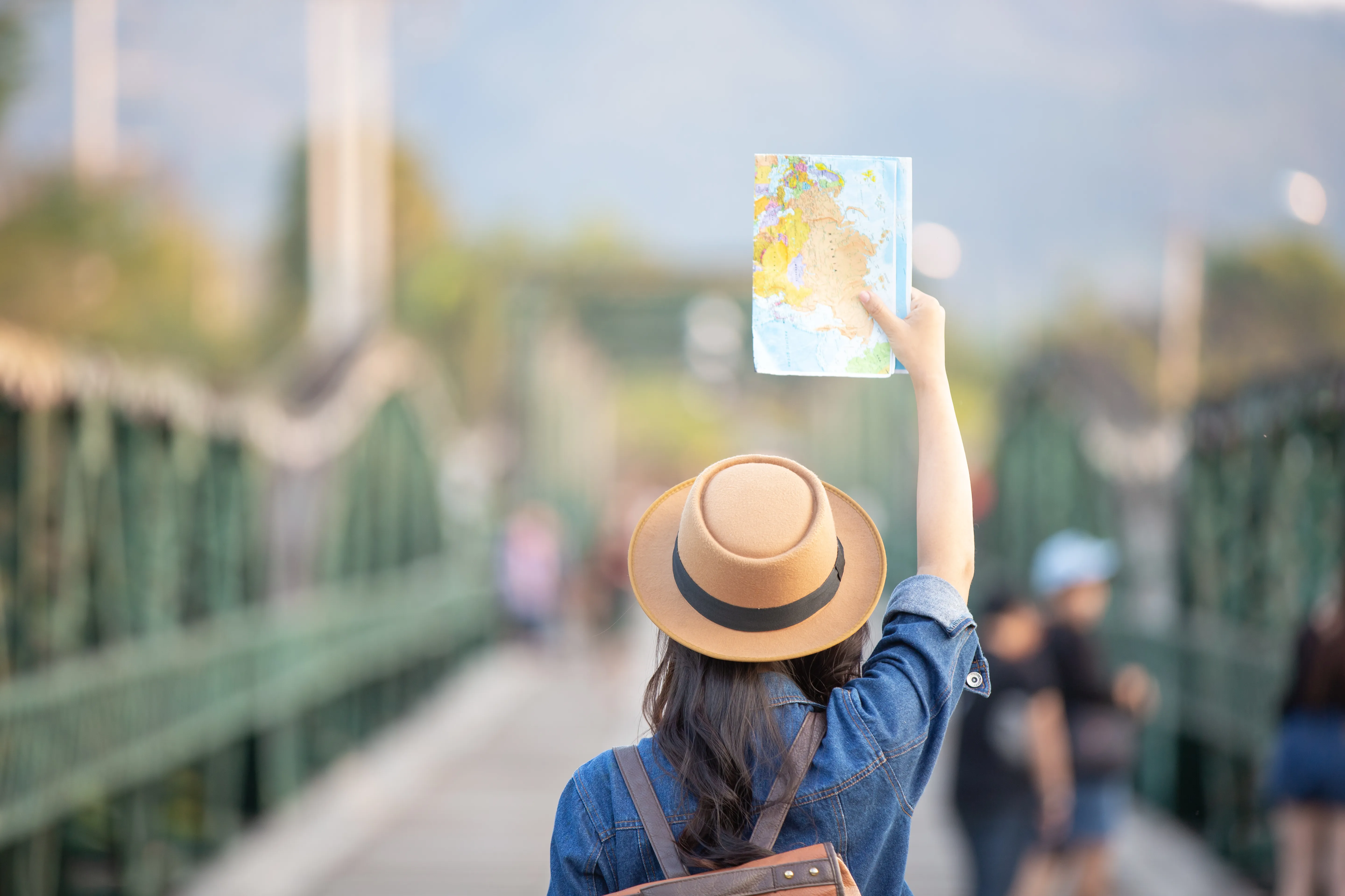 A traveller consulting a map on her journey